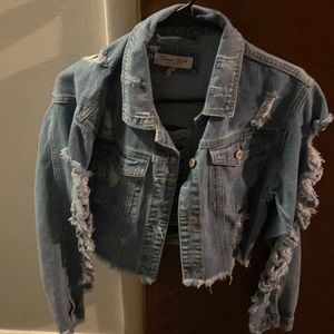 Ripped up denim jacket